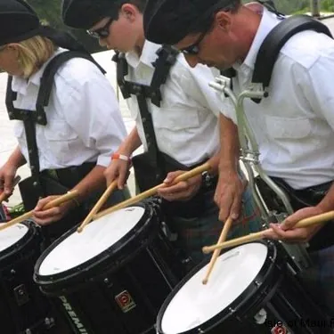 Two drummers playing side by side