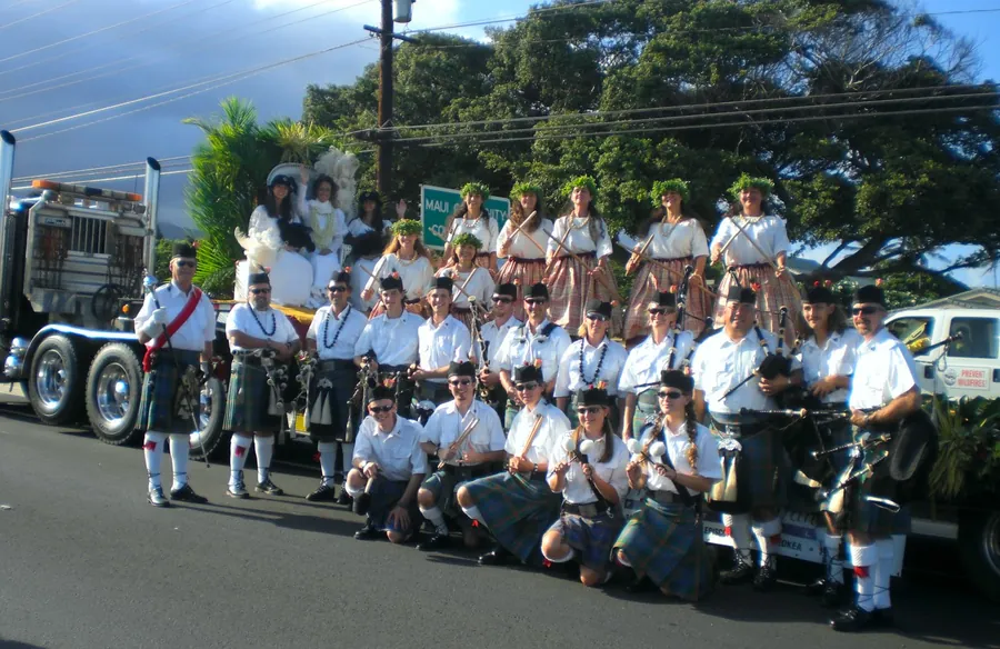 The band gathered in front of a parade truck