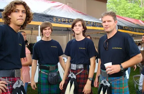 Band members smiling together on St. Patrick's Day